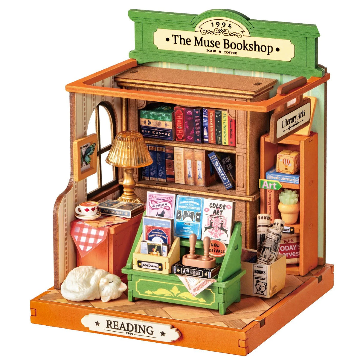 Miniaturmodell einer Buchhandlung mit Regalen, Büchern, einer Lampe und einer schlafenden Katze
