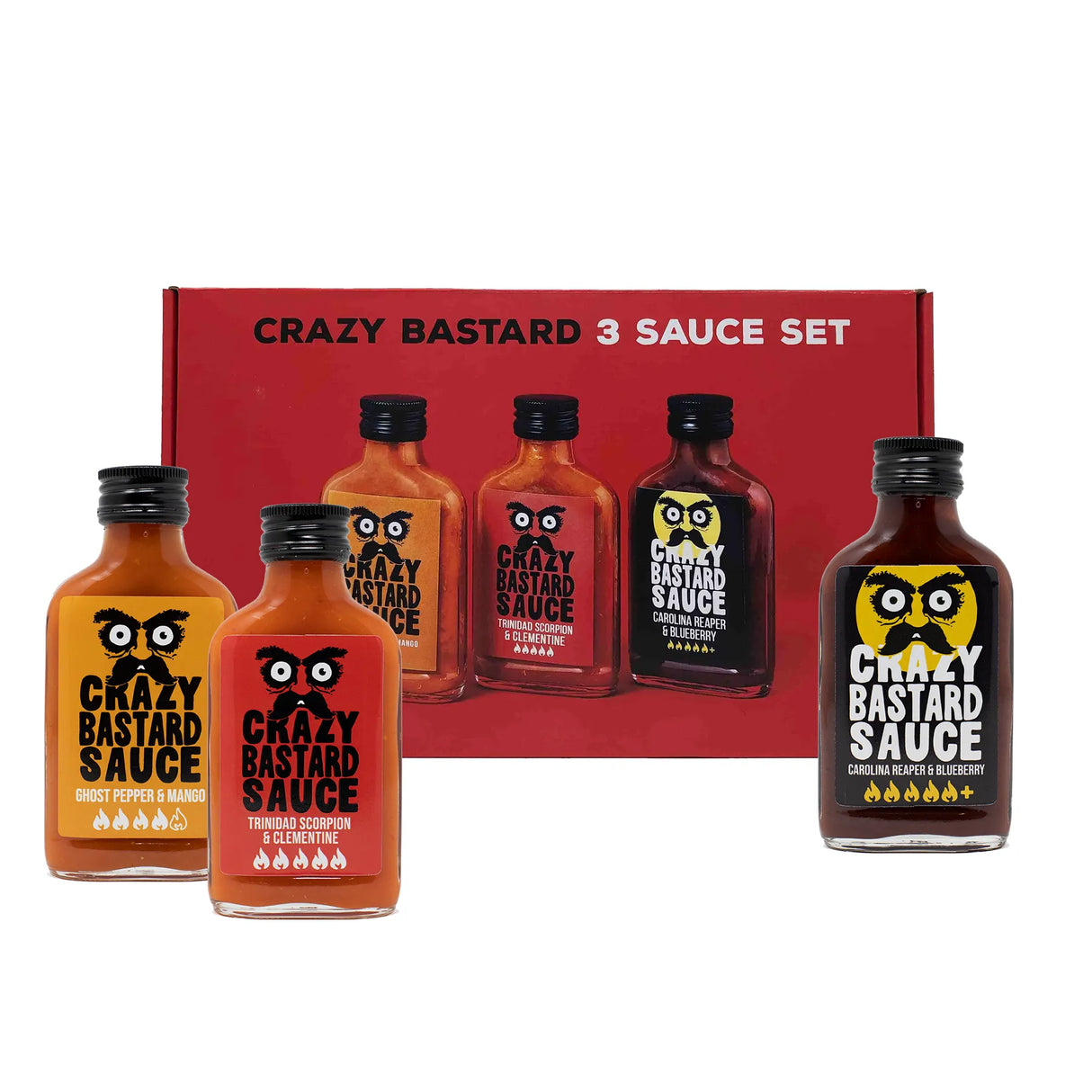 Fünf Flaschen Crazy Bastard Sauce vor einer roten Geschenkbox