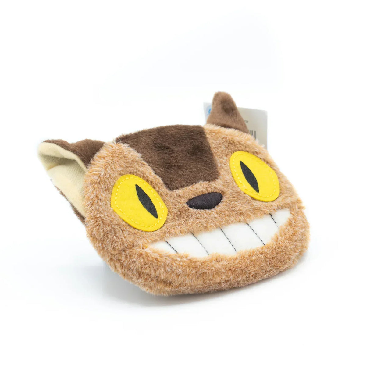 Plüschbeutel in Form eines Katzenkopfes mit gelben Augen und breitem Grinsen