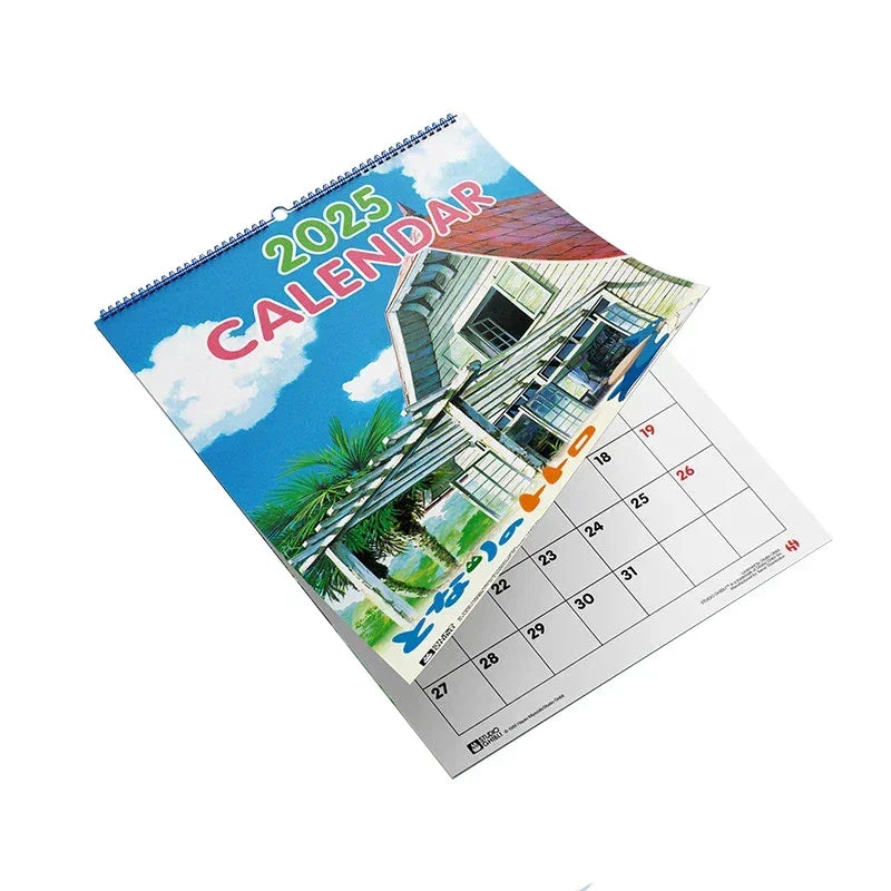 Wandkalender 2025 mit einer Illustration eines Hauses vor blauem Himmel