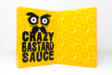 Gelber Chili Adventskalender von Crazy Bastard Sauce mit 24 nummerierten Türchen