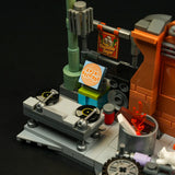 Lego-Szene mit Plattenspielern, Lautsprechern, einem Schild mit der Aufschrift Spin Records und einem Feuer in einem Eimer