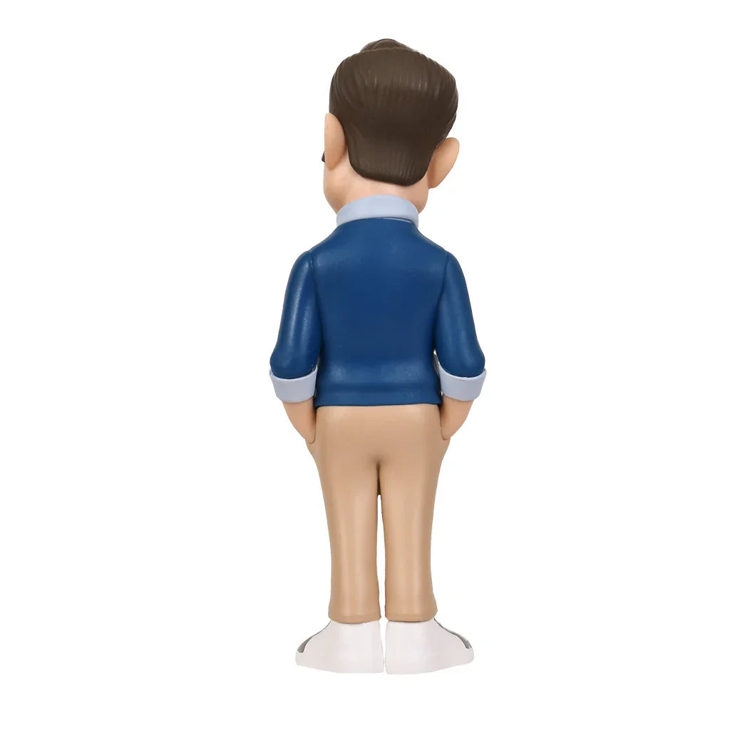Rueckansicht einer maennlichen Wackelkopf Figur mit blauem Pullover und beiger Hose